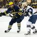 Michigan senior center Kevin Lynch makes contact with Notre Dame junior center T.J. Tynan on Sunday, March 24. Daniel Brenner I AnnArbor.com